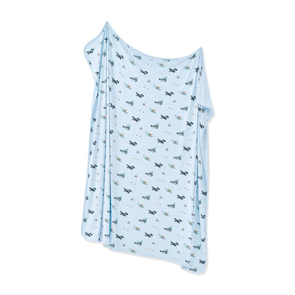 Swaddle Blanket in Take Off shown unswaddled