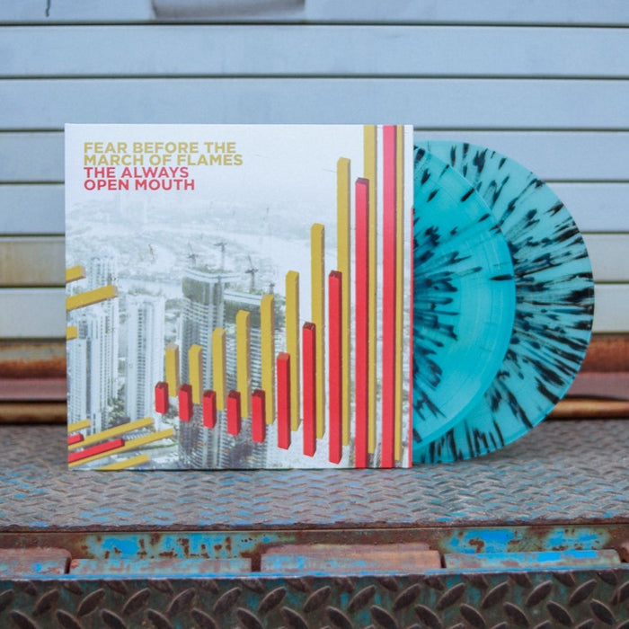 A photo of the vinyl with both LP's peaking out of the jacket. The record is leaned up against a metal warehouse gate.