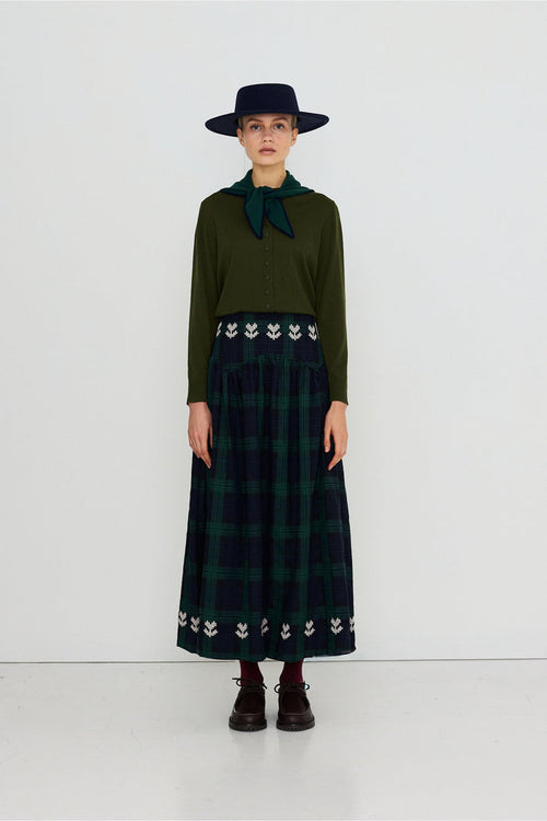 Tiny Big Sister Embroidered Check Skirt AW26-755 on model Shop Tiny Big Sister at Dotique