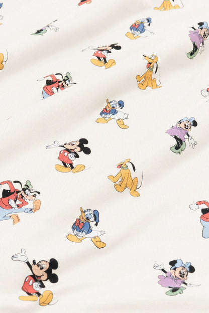 Fabric with mickey mouse and friends print on an oat background