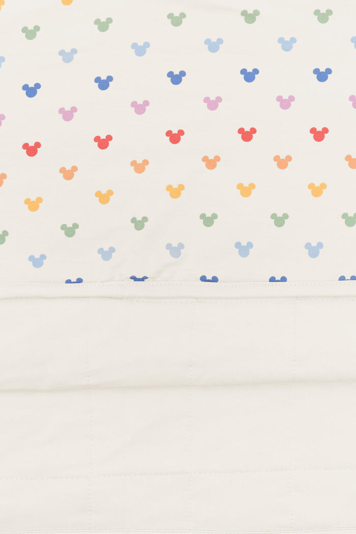 Back side fabric of Toddler Blanket in Pastel Mickey Mouse pattern on an oat background