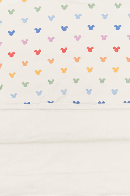 Back side fabric of Toddler Blanket in Pastel Mickey Mouse pattern on an oat background