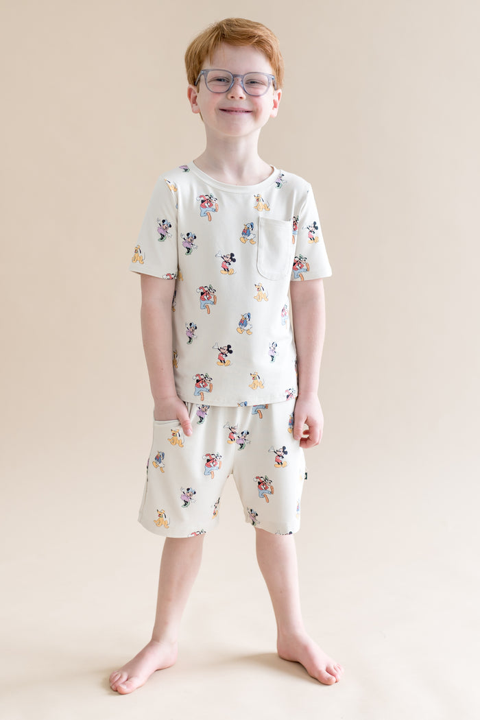 Child wearing Mickey Mouse and Friends printed drawstring shorts with pocket  and matching tshirt