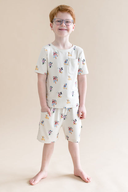 Child wearing Mickey Mouse and Friends printed drawstring shorts with pocket  and matching tshirt