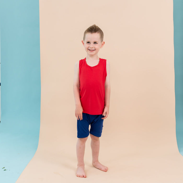 Toddler wearing Kyte Baby bamboo Tank Top in Cardinal red