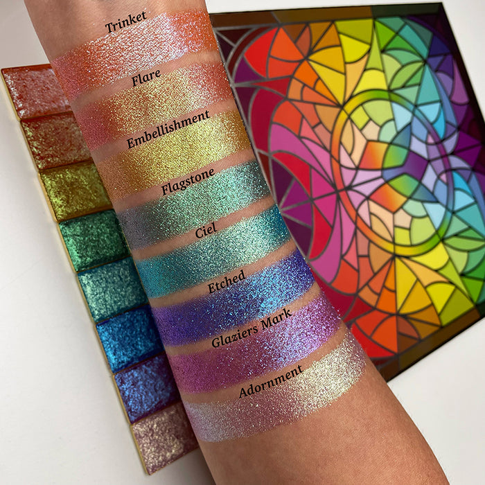 Top angled arm swatches on fair skin tone of Trinket Glitter Multichrome Eyeshadow shifts compared to Flare, Embellishment, Flagstone, Ciel, Etched, Glaziers Mark and Adornment