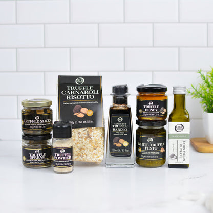Collection of truffle products including jars, a box, and bottles on a kitchen counter.