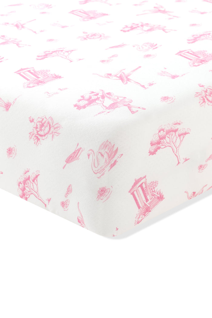 Corner of the Twin Sheet in Toile Ballet on a crib mattress