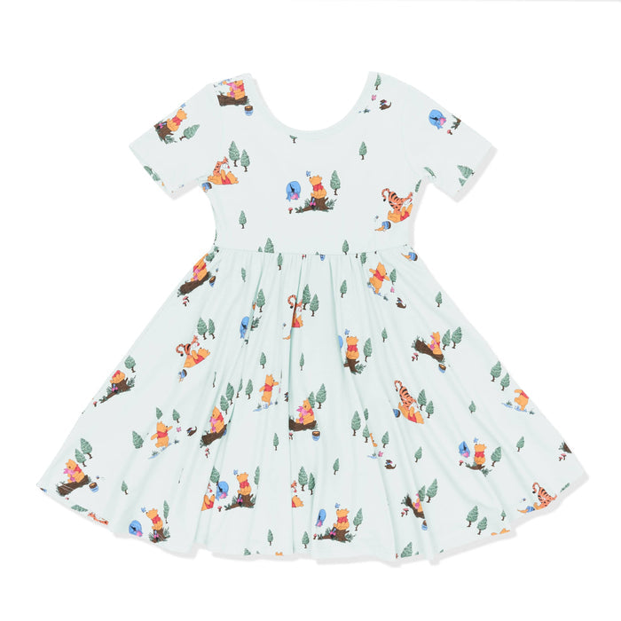 Product photo of the Twirl Dress in Winnie the Pooh Hundred Acre Wood on a white surface