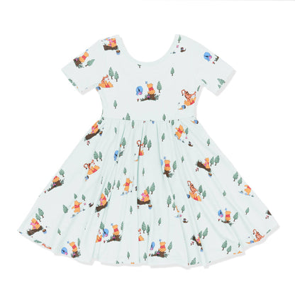 Product photo of the Twirl Dress in Winnie the Pooh Hundred Acre Wood on a white surface