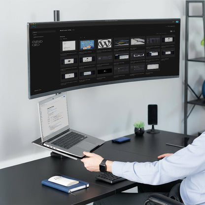 Ultrawide Monitor and Laptop Extra Tall Vertical Desk Mount on desk in office space