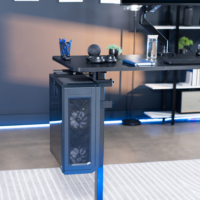 Modern office desk with computer PC under-desk mount in a blurred office setting