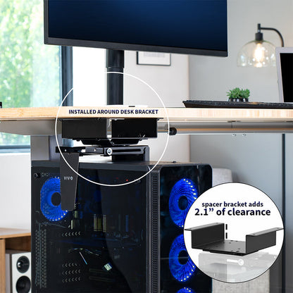 Computer setup with a monitor, desk, and computer tower in a PC mount in a  home office setting.