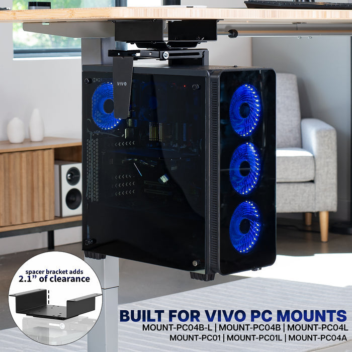 Computer case with blue LED fans on a desk in a room setting, featuring the spacer bracket designed for VIVO PC mounts.