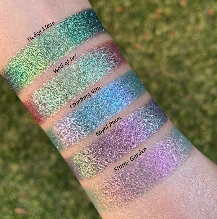 Top angled arm swatches on fair skin of Wall of Ivy Earth Vibrant Multichrome shifts compared to Hedge Maze, Climbing Vine, Royal Plum and Statue Garden