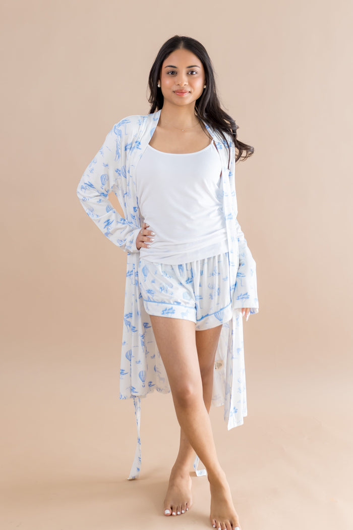 Female modeling the Women's Lounge Robe in Toile Safari paired with matching shorts and a white tank top